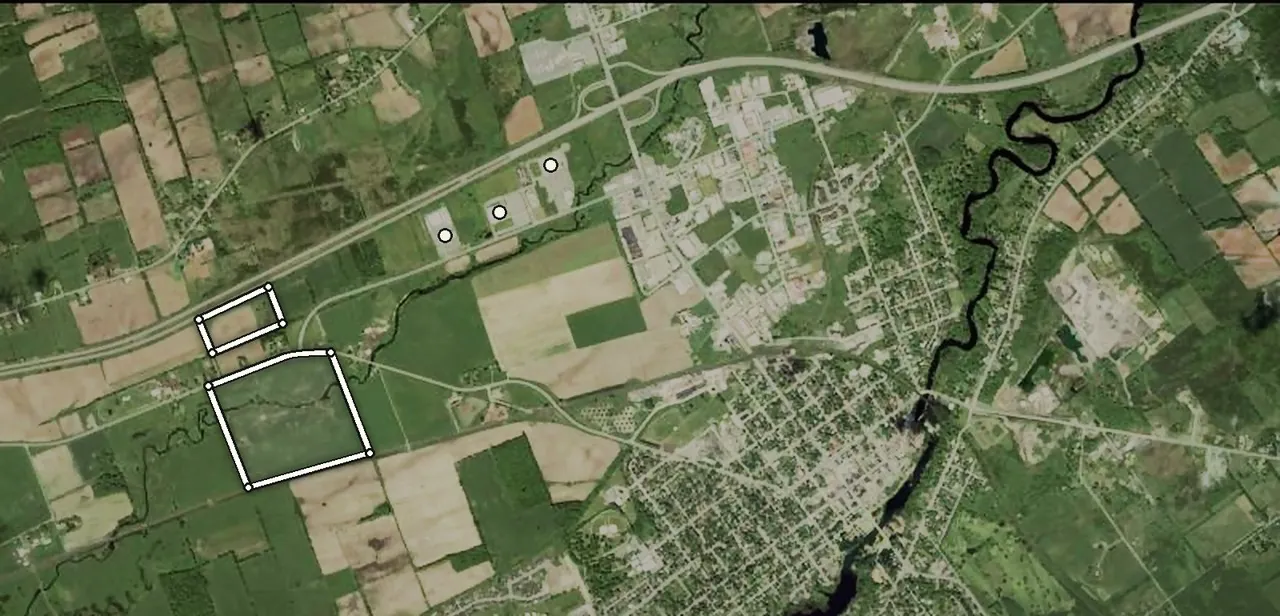 Satellite view of Napanee with both parcels outlined: the 88.5 acres between County Road 1 and the CN line, the 18.3 acres on Highway 401, the 401/Highway 41 interchange at top right and the town at right